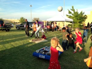 -group of kids playing catch with Sir Ket. 